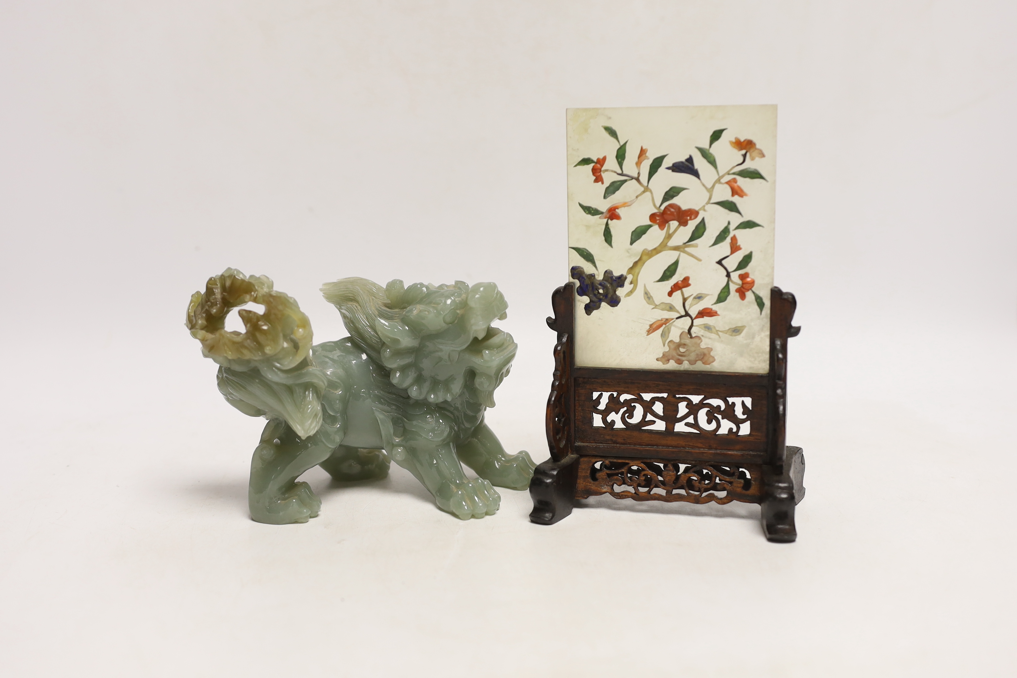 An early 20th century Chinese hardstone, lapis lazuli, coral and hardwood table screen together with a Chinese green jade lion dog, tallest 18cm